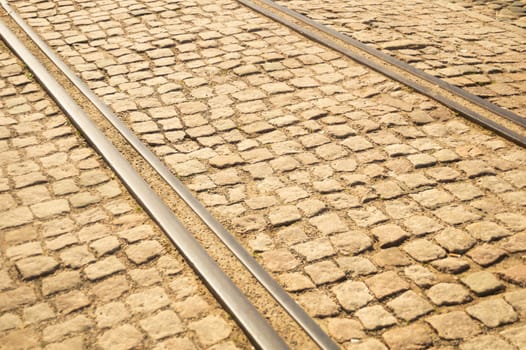 Brick texture. tram rails on stone pavement background
