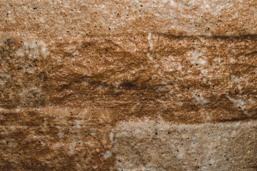 Stone texture background close up. brown stone with cracks on the surface