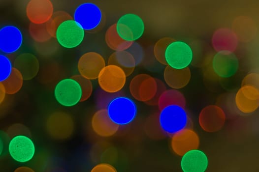 Abstract colorful bokeh defocused lights. holiday background