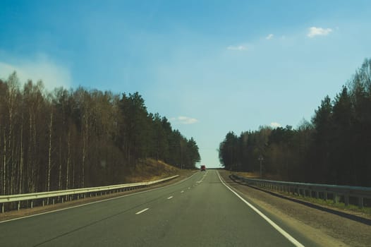 Car driving on a highway. auto moving on a roadway background