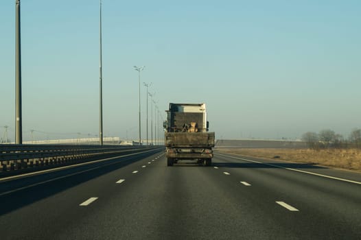 Car driving on a highway. auto moving on a roadway background