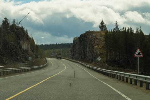 Car driving on a highway. auto moving on a roadway background