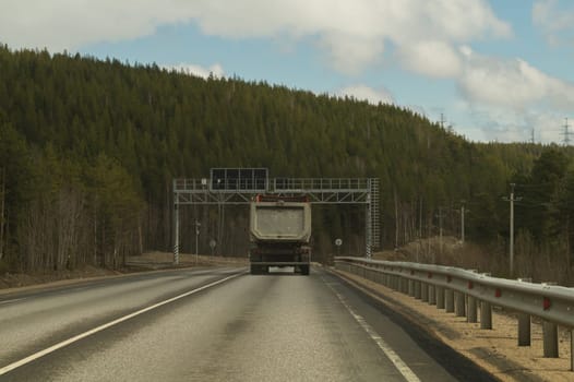 Car driving on a highway. auto moving on a roadway background