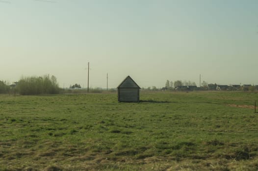 Old wooden house on the countryside. house standing alone among the field