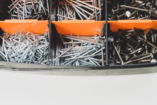 Various metal nails in toolbox background. nails in the cells of the box. copy space
