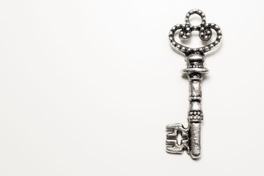 Vintage key isolated on white background. safety and security concept