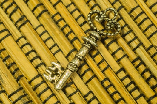 Vintage key on the wooden background. safety and security concept