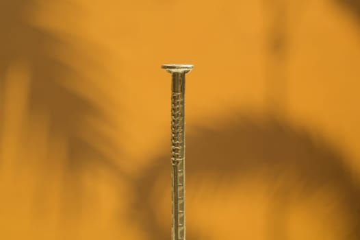 Small metal nail isolated background