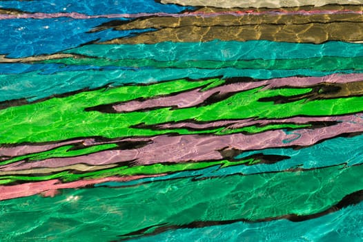 colorful pool water abstract background. colored bottom of the pool with rippled water