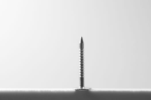 Metal nail isolated on white background