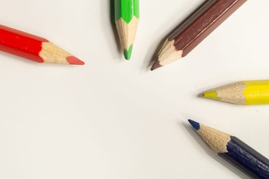 Colorful pencils isolated on white. drawing supplies