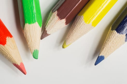 Colorful pencils isolated on white. drawing supplies