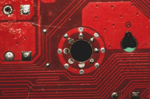 Spoiled motherboard close up. circuit board with dust and defects. modern technologies. micro elements of computer with connections and traces. Intelligent technology abstract background