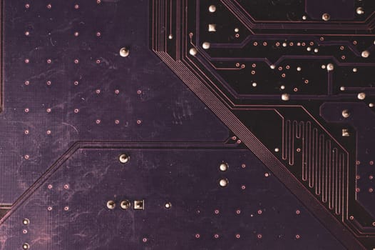 Spoiled motherboard close up. circuit board with dust and defects. modern technologies. micro elements of computer with connections and traces. Intelligent technology abstract background