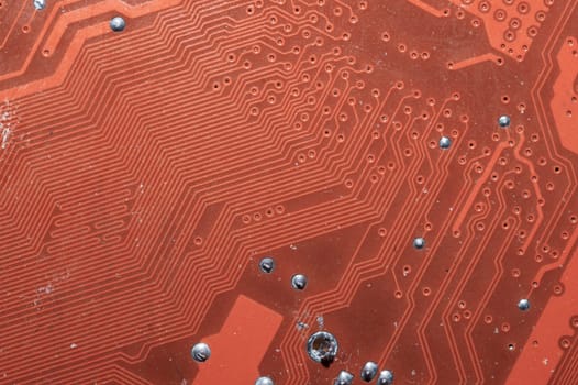 Spoiled motherboard close up. circuit board with dust and defects. modern technologies. micro elements of computer with connections and traces. Intelligent technology abstract background