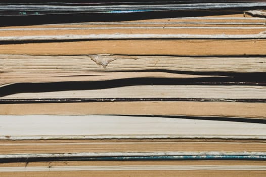 Stack of old books close up abstract background
