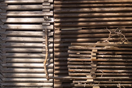 Handcrafted wooden door. plank wall of wooden house