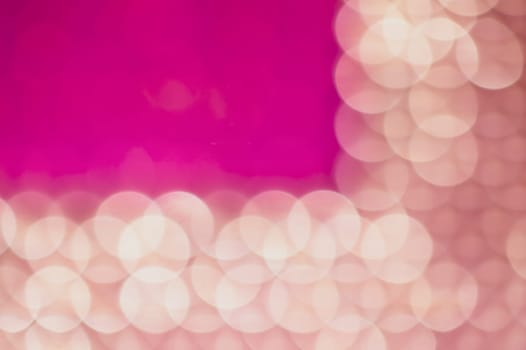 Abstract colorful bokeh defocused lights in pattern of straight rows. holiday background