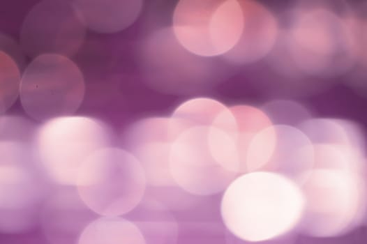 Abstract colorful bokeh defocused lights in pattern of straight rows. holiday background
