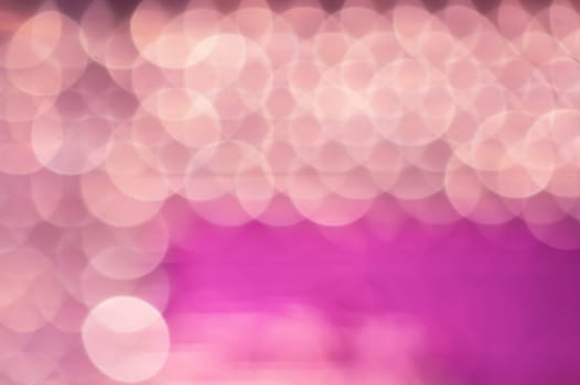 Abstract colorful bokeh defocused lights in pattern of straight rows. holiday background
