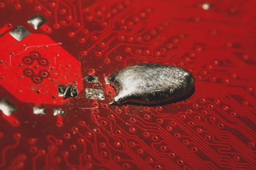 Spoiled motherboard close up. circuit board with dust and defects. modern technologies. micro elements of computer with connections and traces. Intelligent technology abstract background