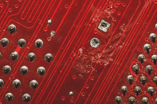 Spoiled motherboard close up. circuit board with dust and defects. modern technologies. micro elements of computer with connections and traces. Intelligent technology abstract background