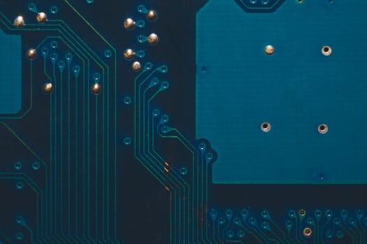 Dusty circuit board. computer motherboard close up. modern technologies. micro elements of computer with connections and traces. Intelligent technology abstract background