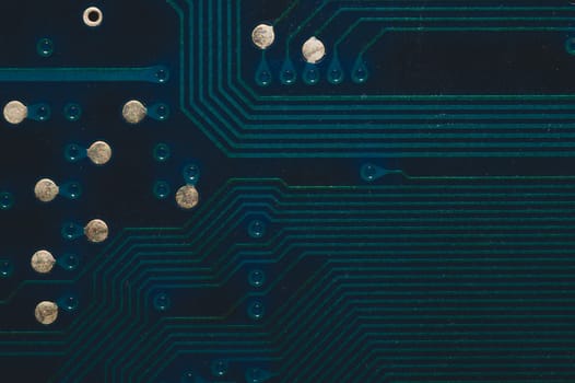 Dusty circuit board. computer motherboard close up. modern technologies. micro elements of computer with connections and traces. Intelligent technology abstract background