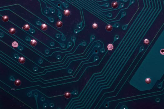 Dusty circuit board. computer motherboard close up. modern technologies. micro elements of computer with connections and traces. Intelligent technology abstract background