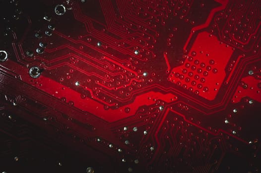 Dusty motherboard close up. circuit board with dust and defects. modern technologies. micro elements of computer with connections and traces. Intelligent technology abstract background