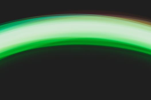 Colorful light traces with long exposure in the dark. abstract blurred lights background