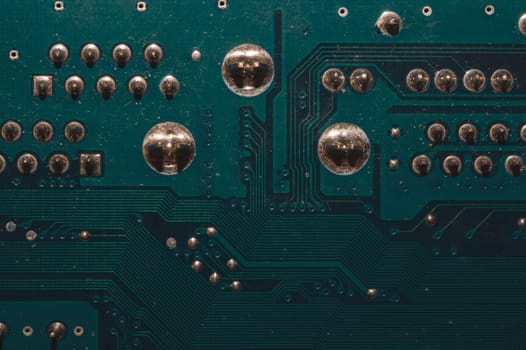Dusty circuit board. computer motherboard close up. modern technologies. micro elements of computer with connections and traces. Intelligent technology abstract background