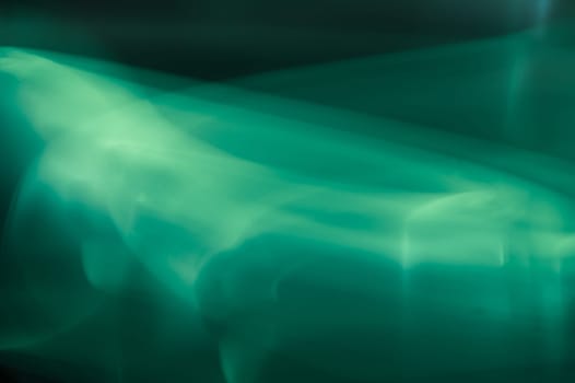 Colorful light traces with long exposure in the dark. abstract blurred lights background