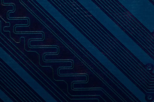 Dusty circuit board. computer motherboard close up. modern technologies. micro elements of computer with connections and traces. Intelligent technology abstract background