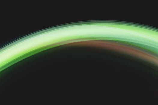 Colorful light traces with long exposure in the dark. abstract blurred lights background