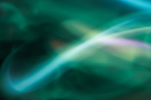 Colorful light traces with long exposure in the dark. abstract blurred lights background