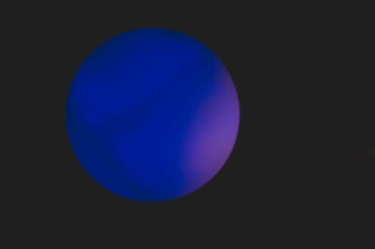 Glowing sphere in the dark. round template with color backlit