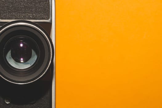 Vintage camera on yellow background. copy space