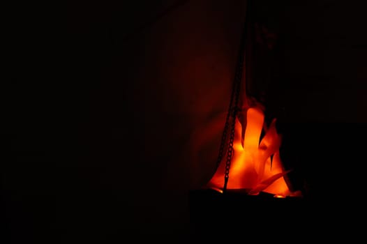 Decorative flame in the dark. hanging lantern at night
