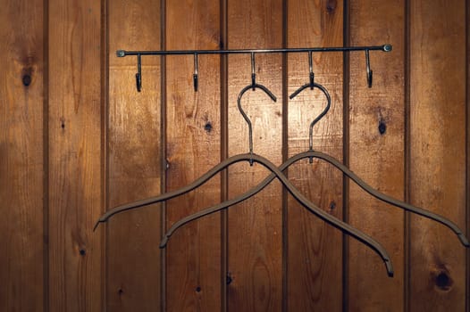 Hangers on wooden wall. dress rack