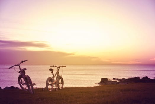 Hipster family fun bikes at sunset. Enjoy summer concept photography.