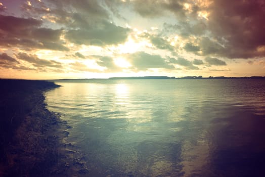 Calm lagoon retro colors landscape at sunset. Chill out concept photography.