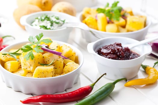 Baked potatoes with chutney and sour cream