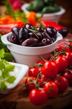 Raw vegetables, yogurt dip and antipasti