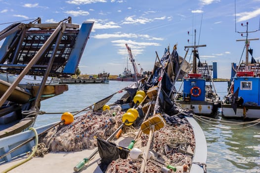Fishing boat and fishing nets in the harbor