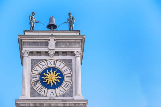 Clock tower, with bell and robots to play it