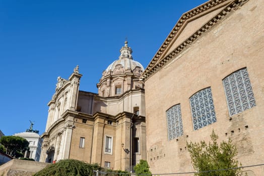 Ruins buildings and statue in the foro romano in Rome italy