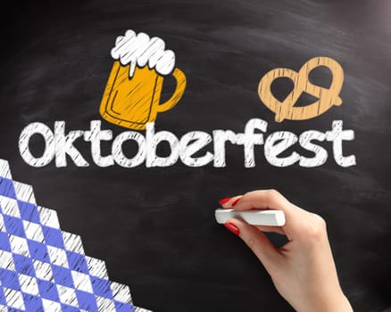 Handwritten Octoberfest Texts with Beer and Pretzel Drawing Design on Black Chalkboard