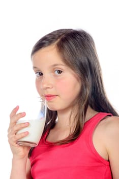 a little girl is drinking a glass of milk on white background