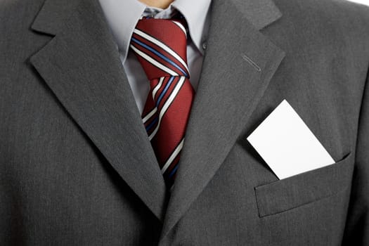 businessman with a blank business card in his pocket